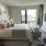 a bedroom with a large window