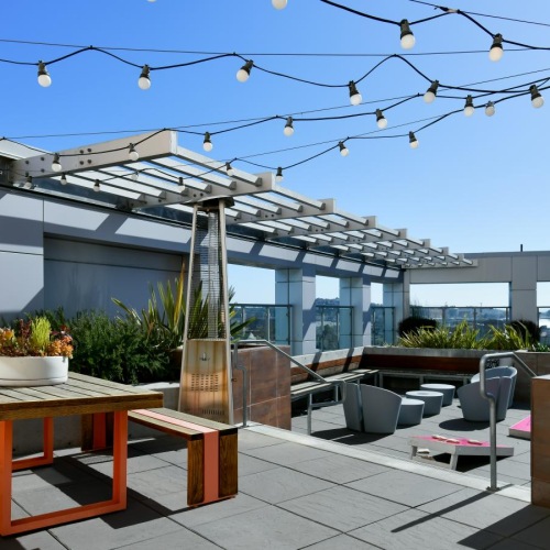 Take advantage of all Venn on Market has to offer a patio with a table and chairs