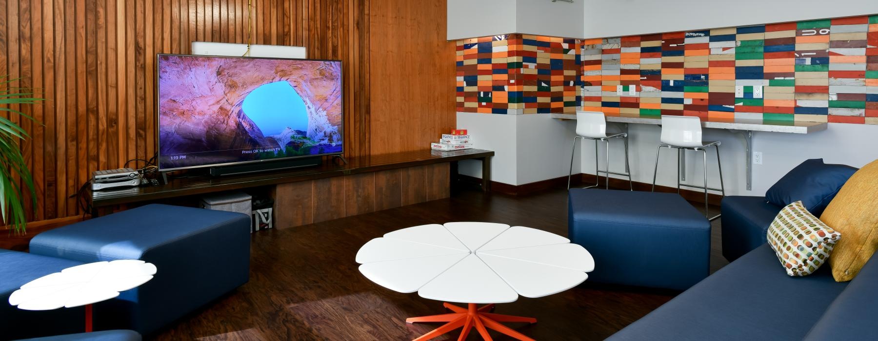 a room with a tv and couches