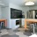 a kitchen with stools and a table