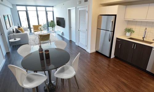 a kitchen with a table and chairs
