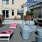 a courtyard with white chairs and tables