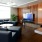 a room with a tv and chairs